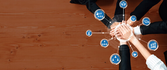 This image depicts hands coming together in a collaborative effort, symbolizing teamwork and unity in a professional environment, emphasizing connection and business growth. Amity