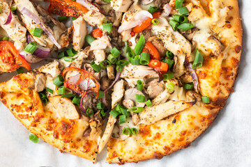 Chicken and vegetable pizza with green onions
