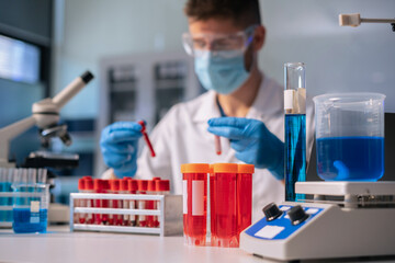 Fototapeta premium Glass vial, pipette and scientist in laboratory for medical study, research or experiment.