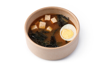 Delicious miso soup served in a warm bowl with tofu and egg © Alex