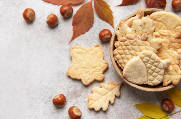 Autumn cookies with nuts and colorful leaves