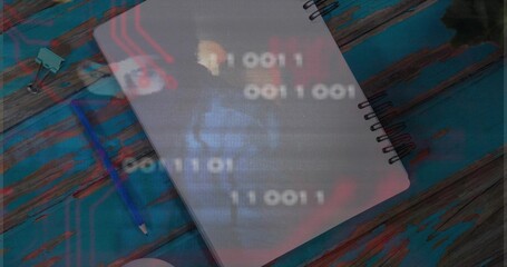 Displaying spiral notebook on desk with binary overlay, circuit graphics and blue pencil
