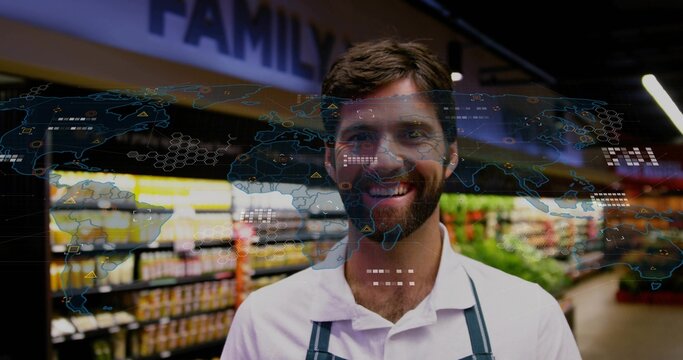 Smiling mid adult grocer wearing white shirt and apron in grocery aisle, with world map overlay