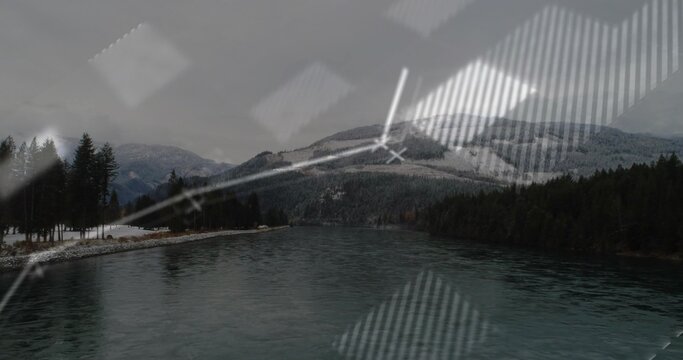 Fototapeta Flowing through mountain valley forest, broad river featuring snowy banks and digital overlay lines