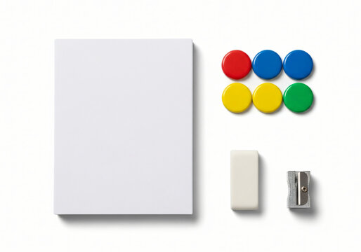 Isolated office and school supplies including paper, magnets, eraser, and pencil sharpener