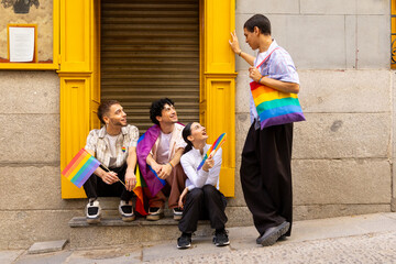 Fototapeta premium Young friends celebrating pride diversity on city street