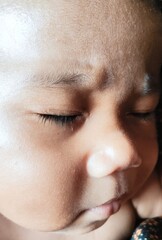 Obraz premium A captured moment of serene slumber, a close-up portrait of a newborn baby's peaceful and innocent face with closed eyes