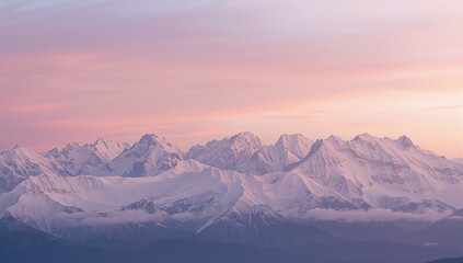 Revealing snowy mountain range in alpine region glowing under pastel sunrise, with drifting mist