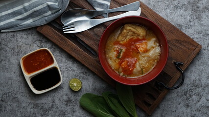 flatlay photography - meatball in a bowl on wooden serving.