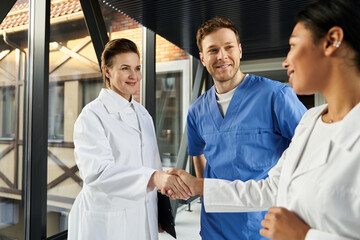 Diverse medical team collaborates in modern hospital environment