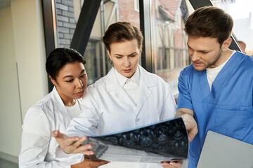 Multicultural medical team collaborating on patient care in a modern hospital setting