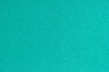 A high-resolution, full-frame texture of a synthetic sports court surface in a vibrant aqua-green or teal color, perfect as an abstract background or backdrop.