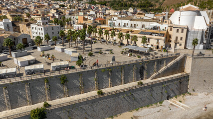 Fototapeta premium Aerial view of the main square of Castellammare del Golfo, a town located in province of Trapani, Sicily, Italy. The town center has many shops, cafes and restaurants.