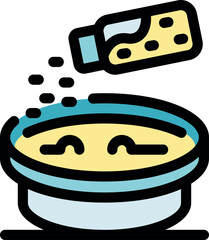 Sprinkling cheese over a delicious soup bowl