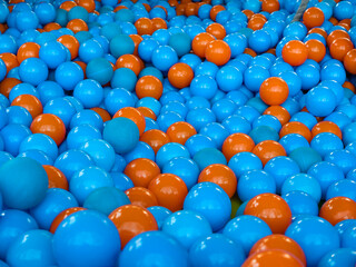 Background of numerous children's plastic balls in blue-purple and brown colors