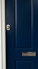 Modern navy blue front entrance door with chrome letterbox and lock.