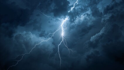 Striking vertical lightning bolt branching through cumulonimbus storm clouds, lighting formations