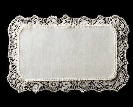 Naklejki Elegant white fabric doily with intricate lace trim on black background. Rectangular, delicate & classic