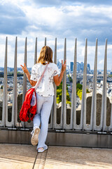Tourist Enjoying View of Paris and La D&eacute;fense Skyline