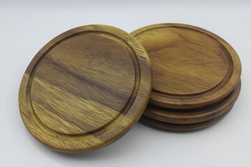 Wooden Coasters Set Round, Brown Isolated Against White, Rustic Tableware. Mock up promotion information for marketing announcements and details, blank white space.