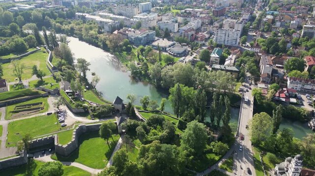 Captivating aerial footage showcase the Vrbas river flowing through the city of Banja Luka, Srpska republic, Bosnia and Herzegovina.