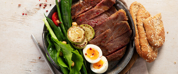 Sliced beef grill steak. Healthy dinner or lunch.