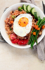 ndonesian nasi goreng (fried rice) served on a plate.
