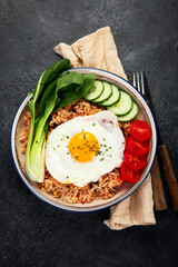 ndonesian nasi goreng (fried rice) served on a plate.