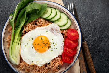 ndonesian nasi goreng (fried rice) served on a plate.