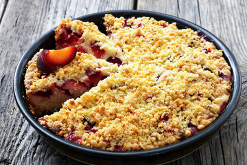 Crumb topped Plum Pie in a baking dish