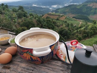 breakfast set boiled rice with perfect mountain view background