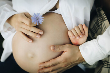 pregnant woman touching her belly