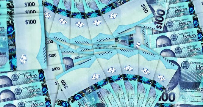 Belize money Belizean dollars banknotes in a cash fan mosaic pattern loop. BZD 100 notes. Abstract concept of bank, finance, economy seamless and looped design background.