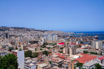 Alger the capital city of Algeria, North Africa, city centre of Algiers, the capital of Algeria, Landscape of Algiers city With port and mediterranean sea and white buildings, Arab Maghreb Africa.