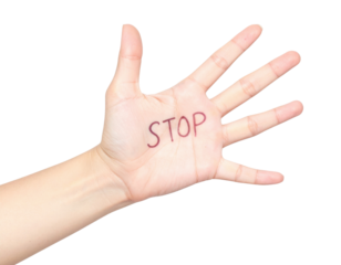 A hand with "STOP" written on the palm, symbolizing a clear message or demand for pause or caution.