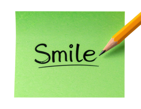 A green sticky note with the word "Smile" written in bold black letters, accompanied by a sharpened yellow pencil.