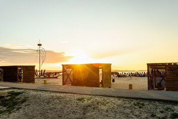 Sandy beach for swimming and sunbathing with changing rooms and deck chairs in Belarus.