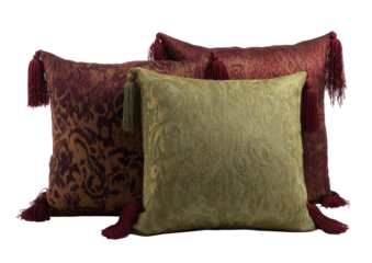 Ornate patterned cushions with tassels, dark background