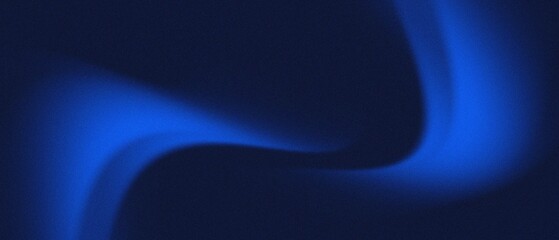 Abstract blue glowing light on dark background.
