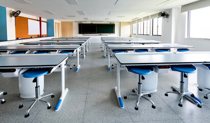 School physics lab classroom with desks and chairs