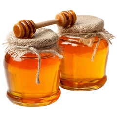 Two rustic jars of golden honey with wooden dippers resting on a textured wooden surface