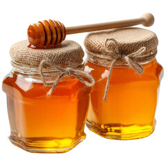 Two jars of golden honey with wooden dipper on rustic table