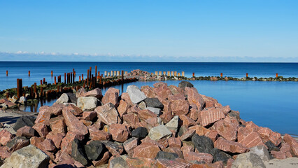 Stones for embankment reinforcement. A pile of stones on the Svetlogorsk beach to reinforce the shoreline.