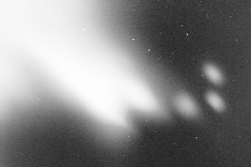 retro film overlay effect with scratch dust and light leaks, retro grain noisy film distressed texture light leak flare on black background,black and white abstract light background © ZMC-Studio