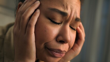 Close up unwell sad anxious African american woman sad face expression girl suffer headache health...