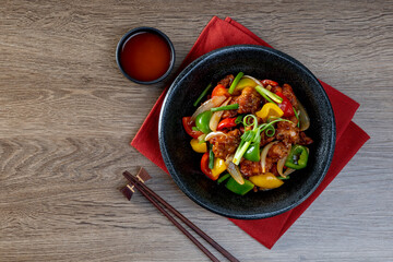 Crispy fried chicken, sweet and sour on the wooden table