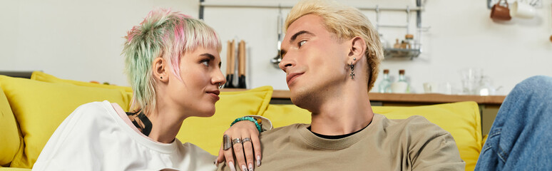 Young couple enjoying a moment of bliss in a cozy living room filled with sunshine