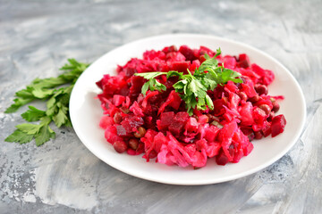 Vinaigrette Salad with Beets and Parsley on white plate