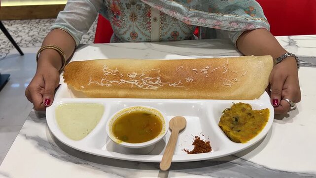 Big sized masala dosa served with chutney and sambhar