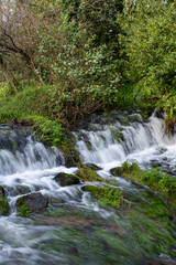 Waterfall flowing between rock formations